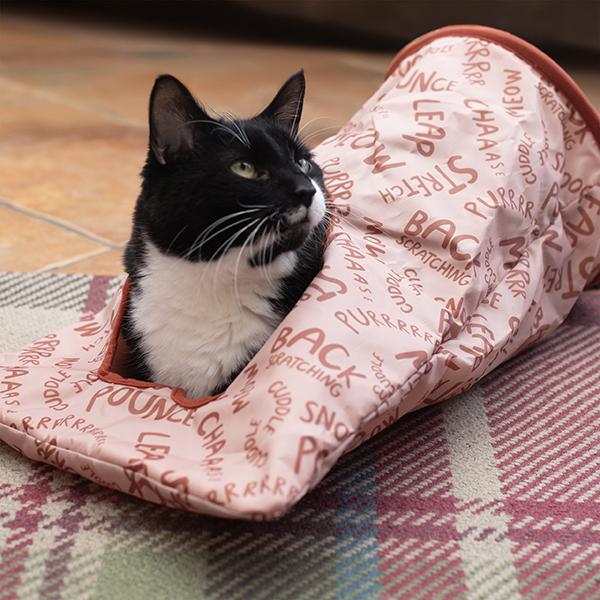 Black and white cat plays in Rosewood Battersea Peek-A-Boo Sack picture 4 photos copyright to https://rosewoodpet.com/cat/play-time/battersea/battersea-peek-a-boo-sack